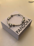 Pandora sølvarmbånd med 10 charms – ALE 925
